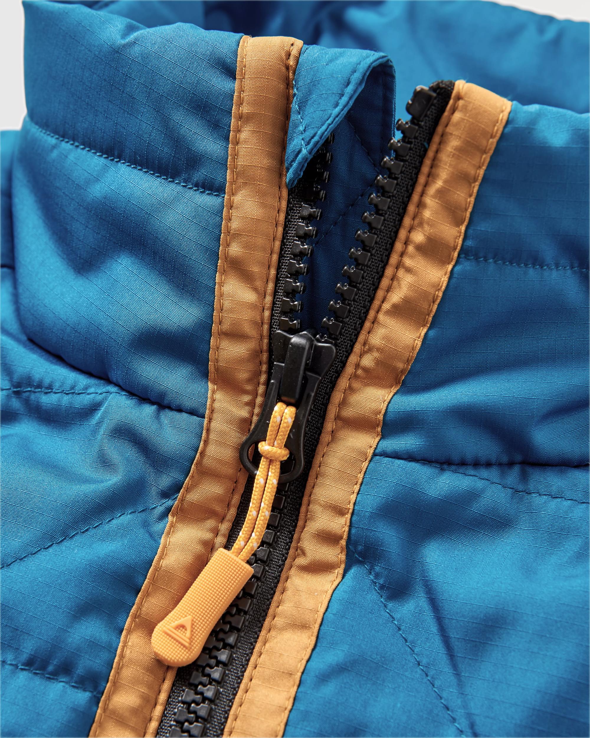 Trace Recycled Thermore® Insulated Jacket - Corsair Blue/ Jungle Green - Flatlay