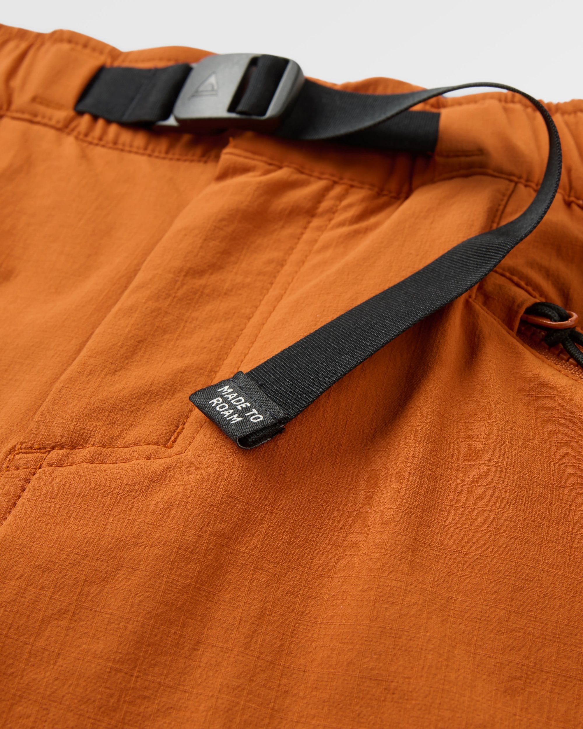 Sandstone Recycled Active Trail Short - Sunset Orange - Flatlay